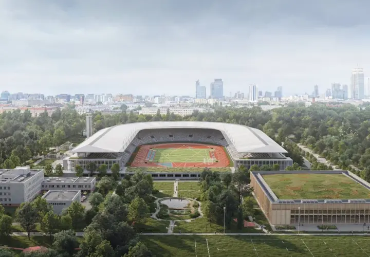 Nowoczesny stadion lekkoatletyczny z bieżnią i boiskiem, otoczony zielenią, w tle panorama miasta. To przyszłość Agrykoli.