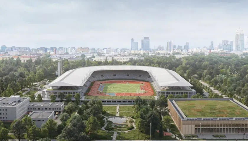 Nowoczesny stadion lekkoatletyczny z bieżnią i boiskiem, otoczony zielenią, w tle panorama miasta. To przyszłość Agrykoli.